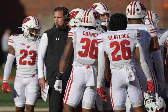 Oct 21, 2023; Champaign, Illinois, USA; Wisconsin Badgers head coach Luke Fickell with his players during the first half against the Illinois Fighting Illini at Memorial Stadium. Mandatory Credit: Ron Johnson-USA TODAY Sports